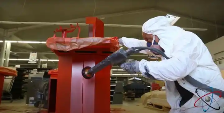 Remise en peinture électrostatique sur une caisse de magasin